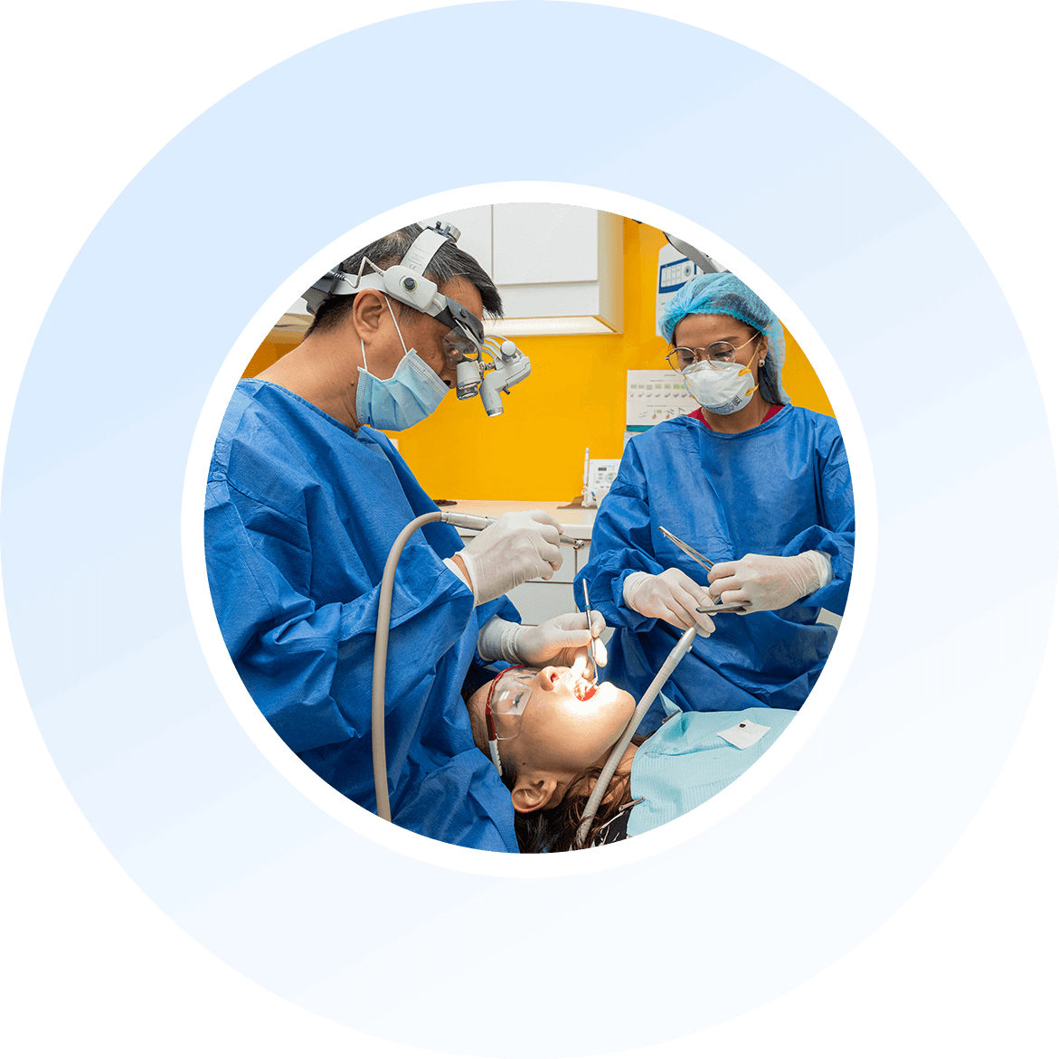 Dental team caring for a patient at Implantdontics